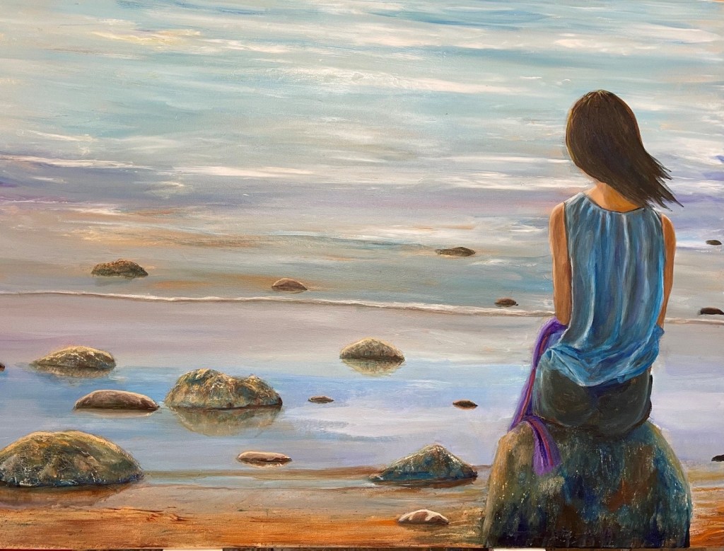 A painting by svali. A young woman is sitting on a rock looking out over the ocean. She has her back to the viewer, her shoulder length brown hair is being blown by the breeze. Smaller rocks are sticking up out of the water and the rock the woman is sitting on is on some reddish brown sand. There are small waves on the ocean, the water looks calm. Strips of white clouds gently stretch across the light blue sky. The woman is wearing a flowing blue, sleeveless top, black bottoms, and has what looks like a purple scarf draped over her lap. The painting has a contemplative feel to it.